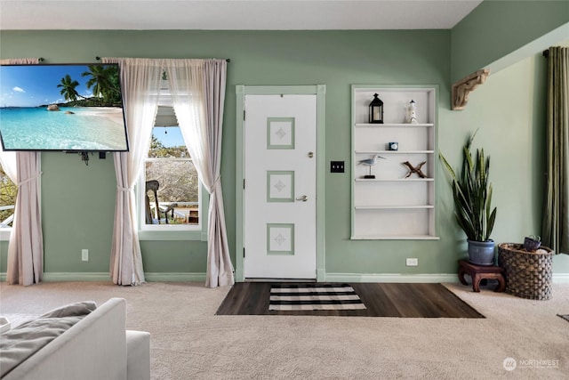 entrance foyer featuring carpet floors