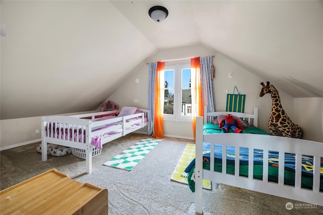 carpeted bedroom with lofted ceiling