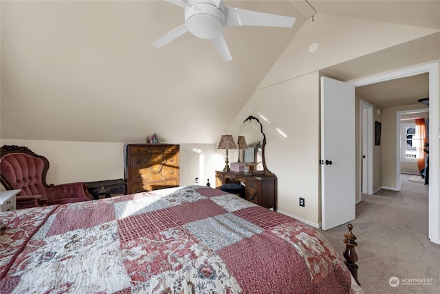 bedroom featuring ceiling fan, vaulted ceiling, and light carpet