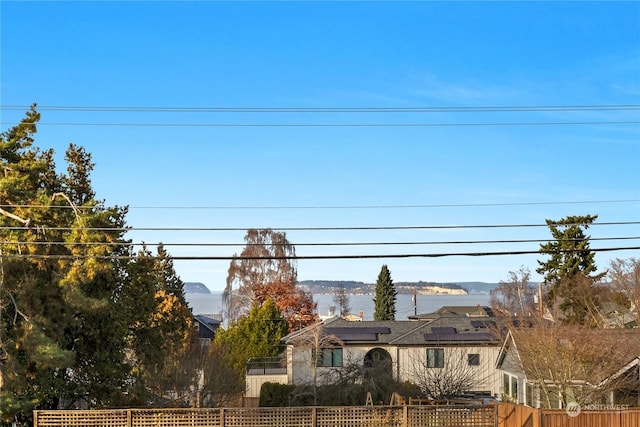 exterior space featuring a water and mountain view