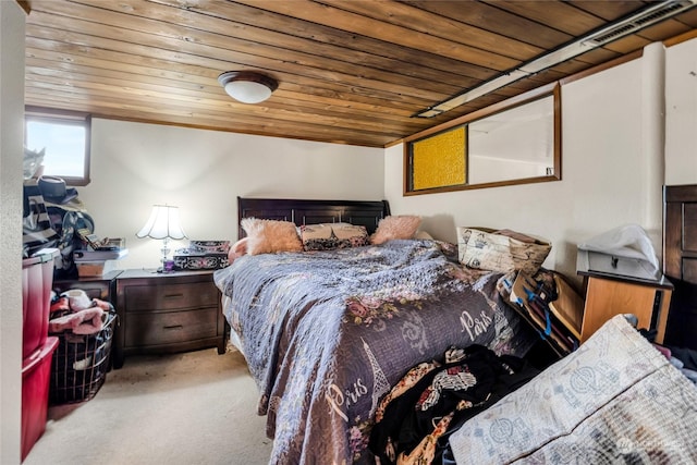 carpeted bedroom with wood ceiling