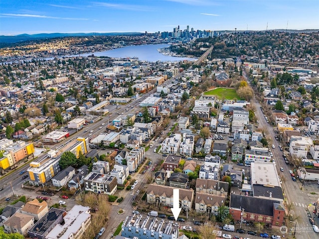 birds eye view of property featuring a water view