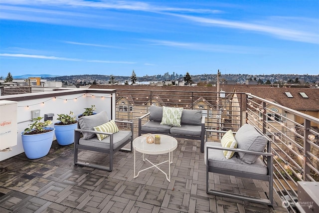 view of patio with a balcony and outdoor lounge area