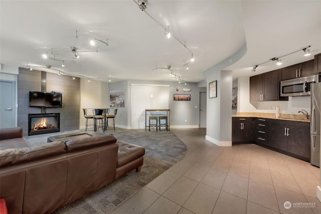 tiled living room featuring a fireplace