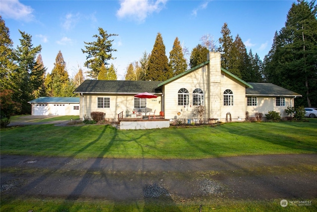 ranch-style home featuring a garage and a front yard