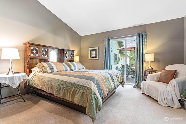 bedroom featuring light carpet, access to exterior, and vaulted ceiling