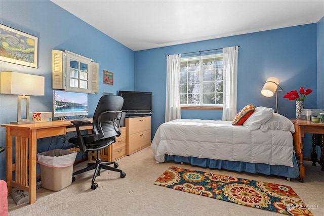 bedroom featuring light colored carpet