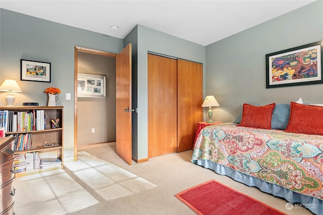 carpeted bedroom featuring a closet