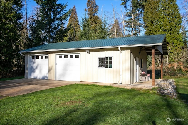 garage featuring a yard