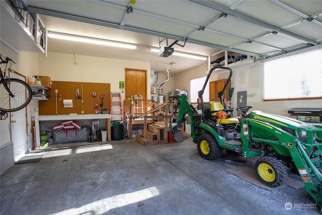 garage featuring a workshop area and a garage door opener