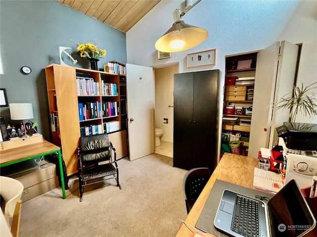 carpeted office space with wooden ceiling