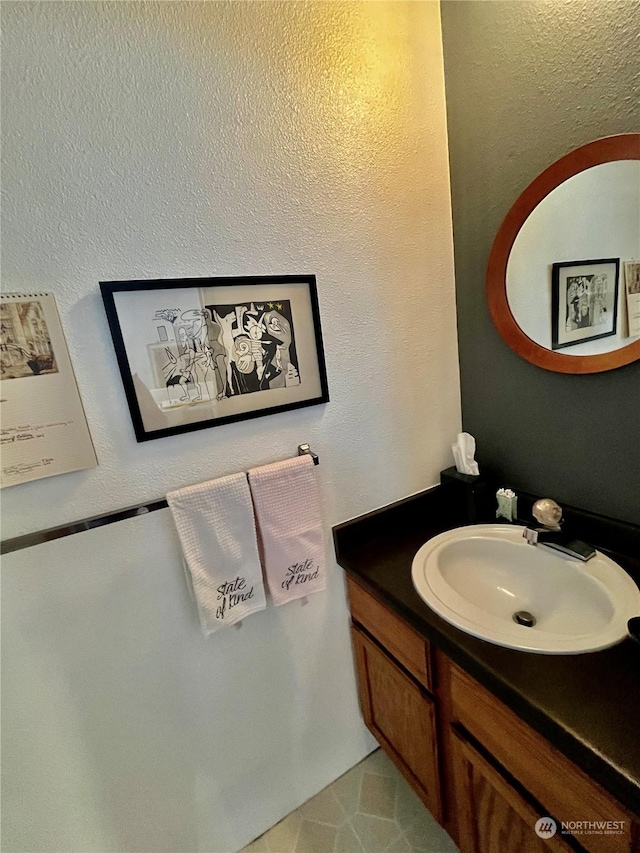 bathroom with tile patterned floors and vanity