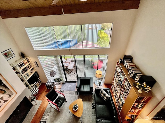 room details featuring hardwood / wood-style floors, beamed ceiling, and wooden ceiling