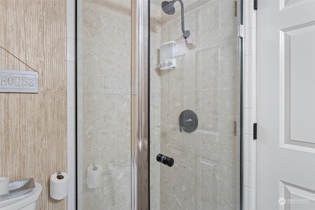 details featuring walk in shower, toilet, and wood walls