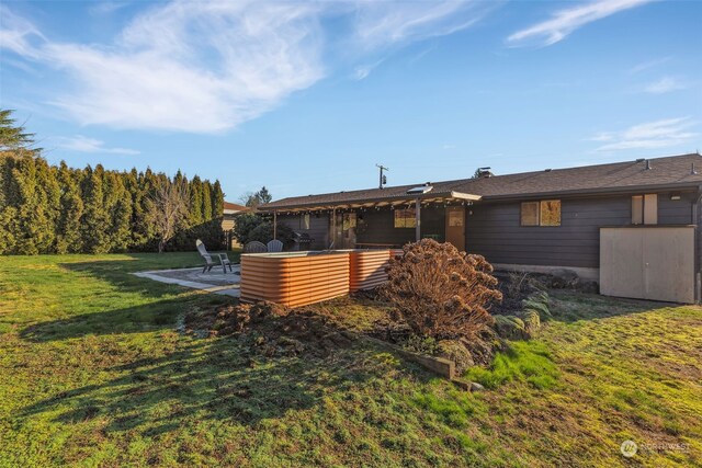 exterior space with a patio area and a yard