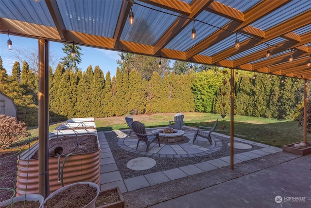 view of patio / terrace featuring an outdoor fire pit