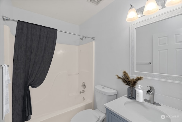 full bathroom featuring toilet, vanity, and bathtub / shower combination