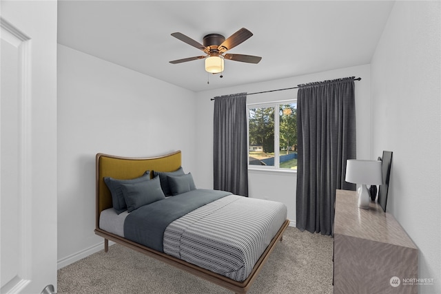 carpeted bedroom with ceiling fan