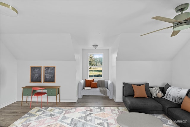 interior space with ceiling fan and wood-type flooring