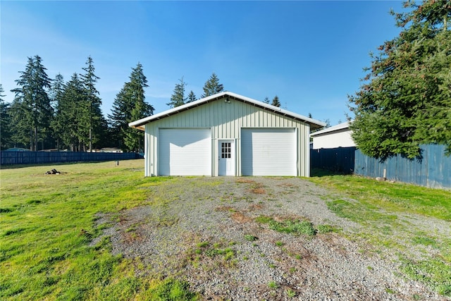 garage featuring a yard