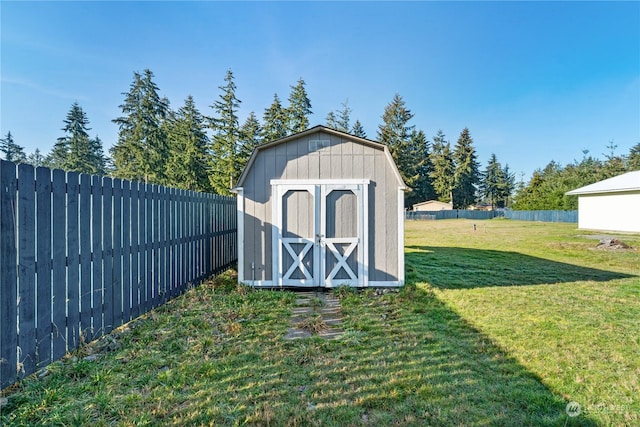 view of outdoor structure featuring a lawn