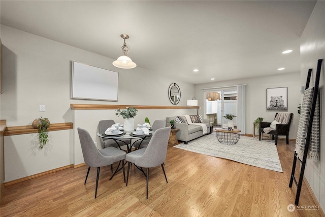 dining area featuring light wood-type flooring