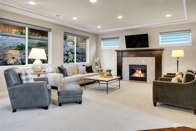 carpeted living room with a fireplace