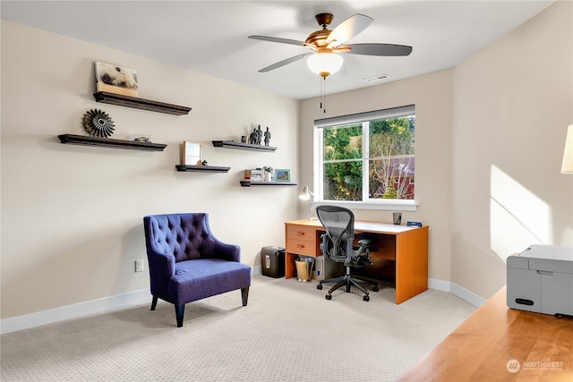 office with light colored carpet and ceiling fan