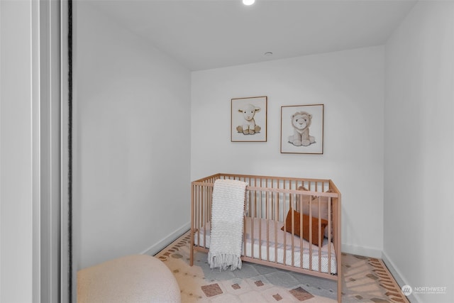 bedroom with a nursery area