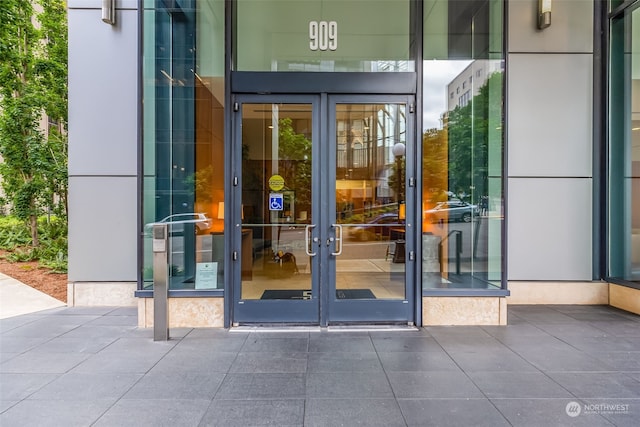 view of exterior entry featuring french doors