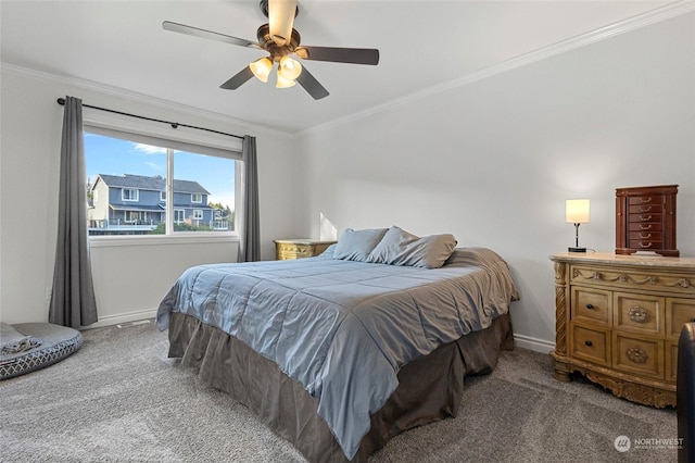 carpeted bedroom featuring ceiling fan and ornamental molding