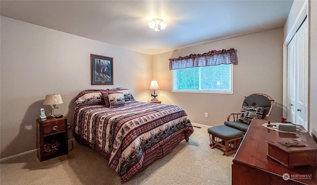 bedroom with a closet and carpet flooring