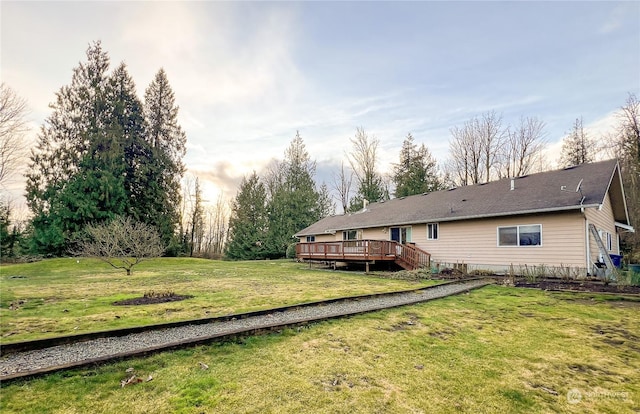 yard at dusk with a wooden deck