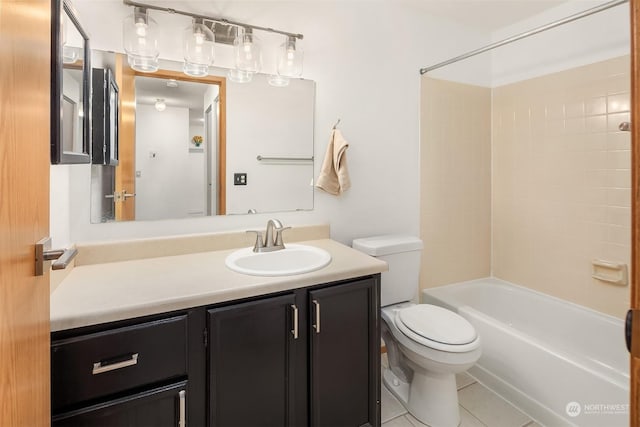 full bathroom with tiled shower / bath, vanity, toilet, and tile patterned flooring