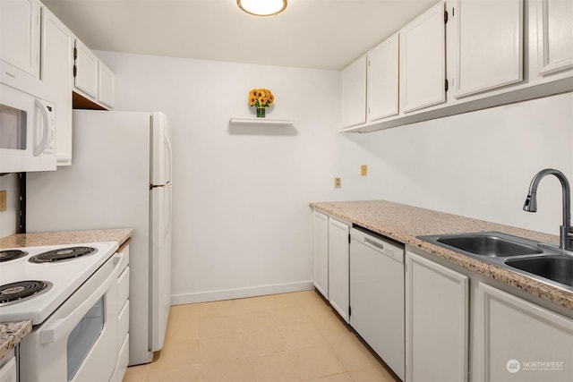 kitchen with white cabinetry, sink, and white appliances