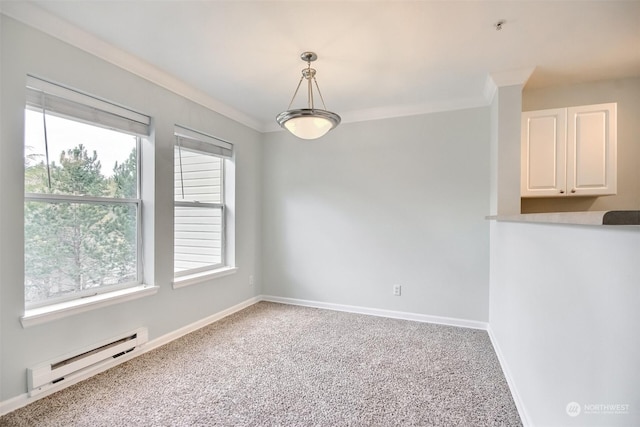 empty room with baseboard heating, crown molding, and carpet