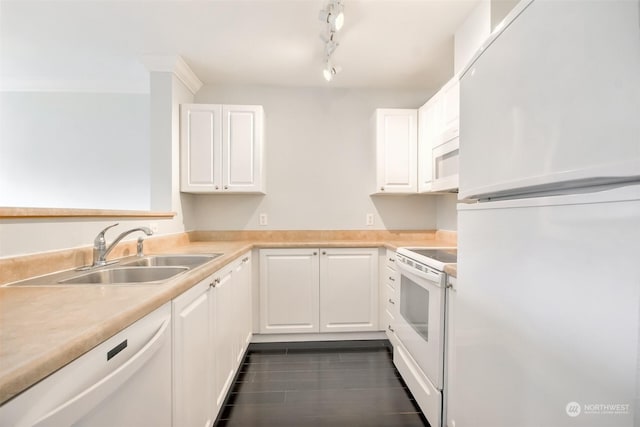 kitchen with white cabinetry, white appliances, rail lighting, and sink