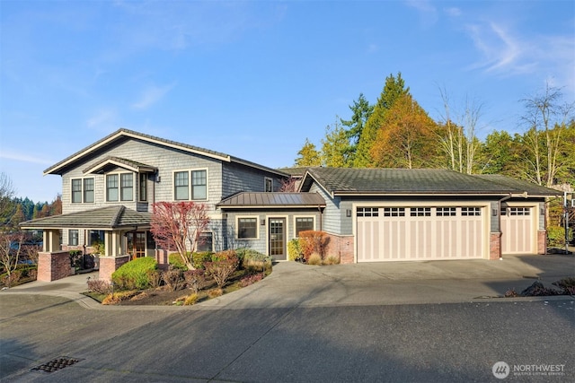 view of front of property with brick siding, driveway, and an attached garage