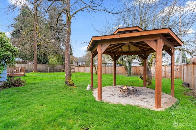 view of yard with an outdoor fire pit