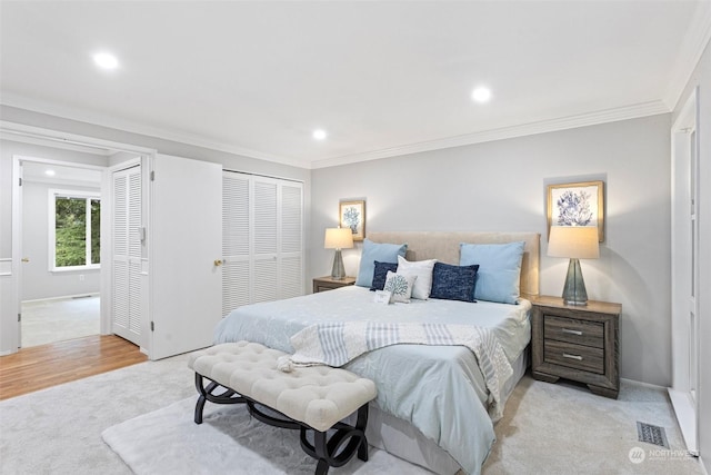 carpeted bedroom with ornamental molding