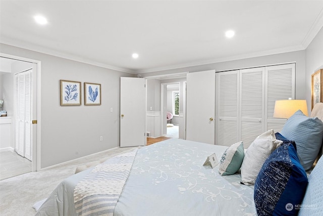 bedroom with crown molding, light colored carpet, and a closet