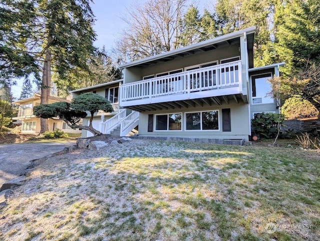 rear view of house with a yard