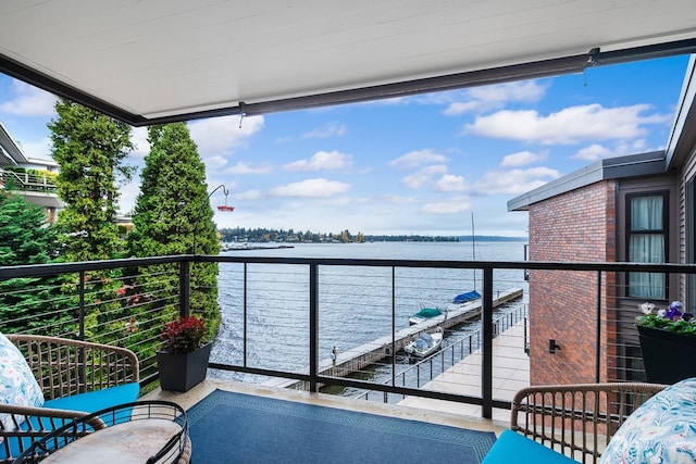 balcony featuring a water view