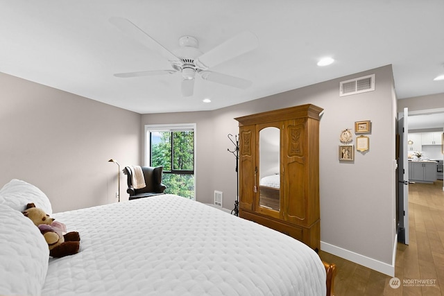 bedroom featuring ceiling fan and hardwood / wood-style floors