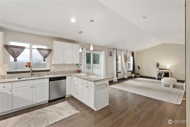 kitchen featuring white cabinets, dishwasher, sink, and lofted ceiling