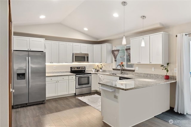 kitchen featuring white cabinetry, hanging light fixtures, sink, kitchen peninsula, and stainless steel appliances