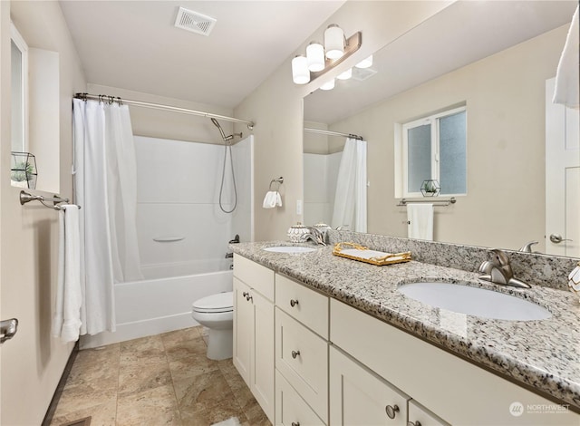 full bathroom with vanity, toilet, and shower / tub combo with curtain