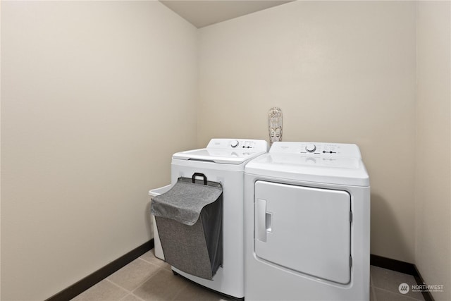 washroom featuring light tile patterned floors and independent washer and dryer