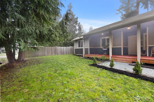 view of yard with a wooden deck