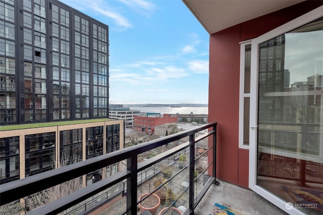 balcony featuring a water view